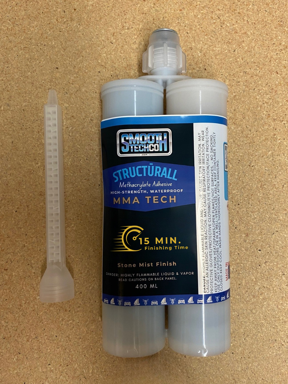 MMA FIVE structural adhesive, 400 ml, & static mixer on a cork background.