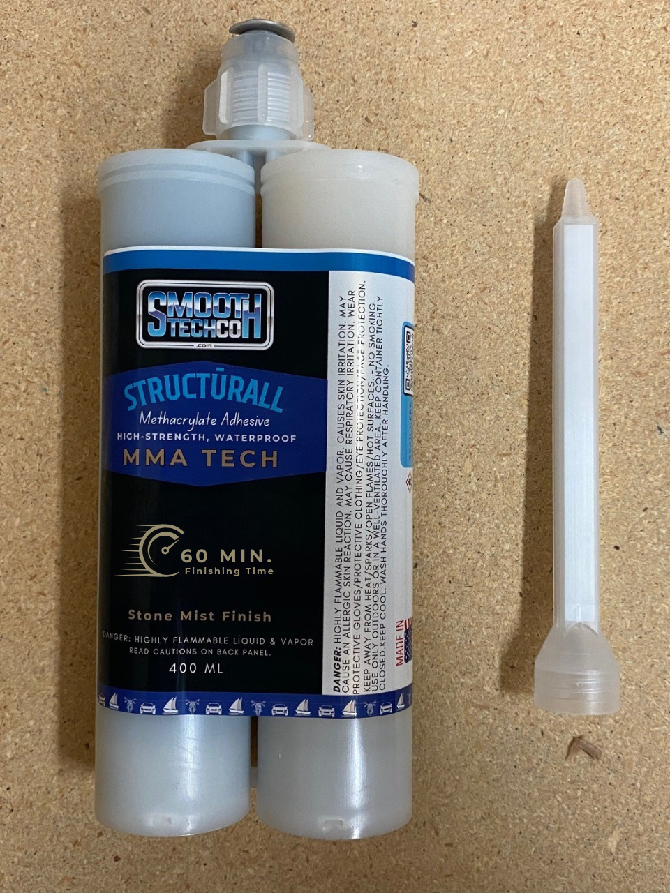MMA Twenty structural adhesive, 400 ml, & static mixer on a cork background.