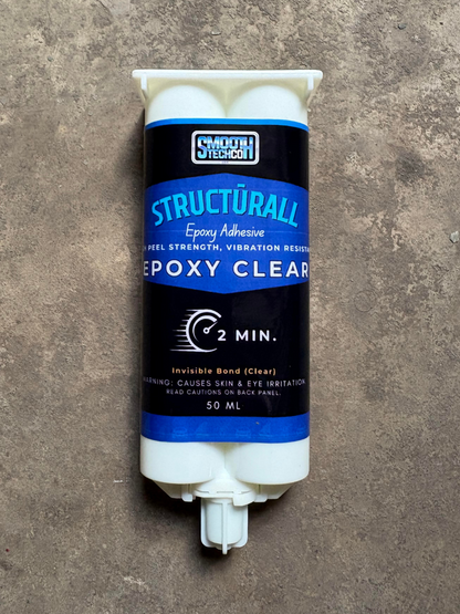 Tube of Structurall Epoxy Clear Adhesive on a concrete surface